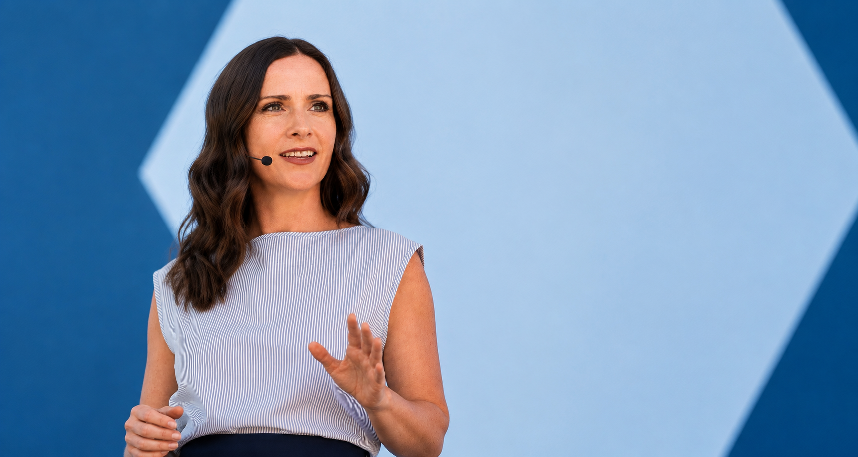 Rebecca Domorev speaking on stage.